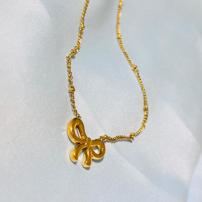 Elegant Gold Bow Pendant