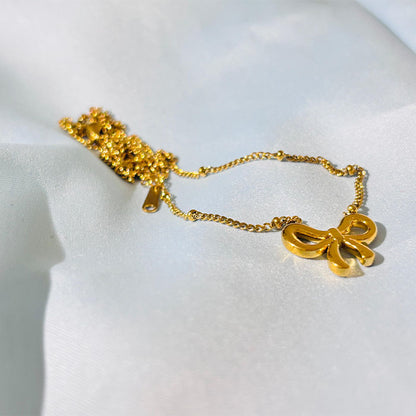 Elegant Gold Bow Pendant