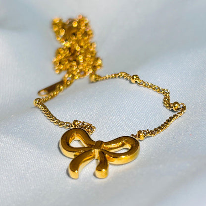 Elegant Gold Bow Pendant