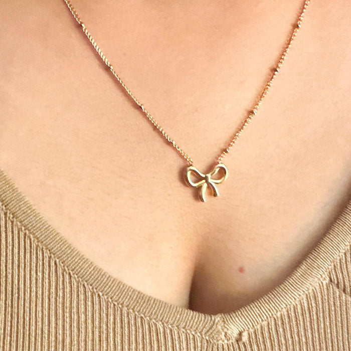 Elegant Gold Bow Pendant