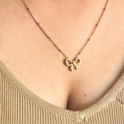 Elegant Gold Bow Pendant